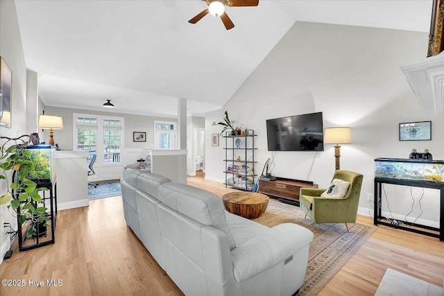 10196 Flint Ct SE, Leland, NC 28451 - living room featuring a ceiling fan, light wood-style flooring, high vaulted ceiling, and baseboards