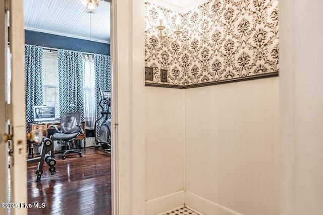 bathroom featuring crown molding and hardwood / wood-style flooring