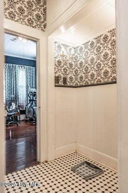 bathroom with a wainscoted wall