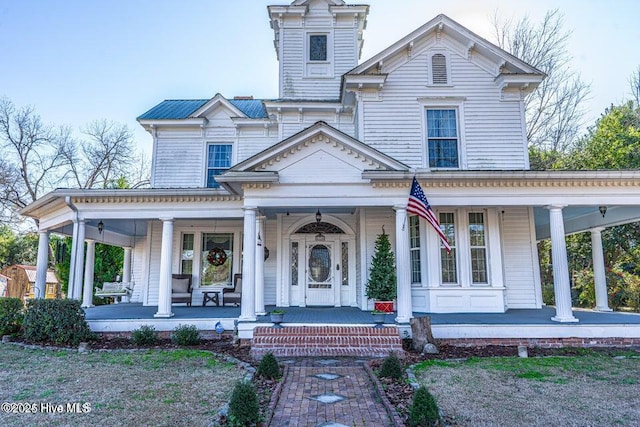 italianate-style house with a porch