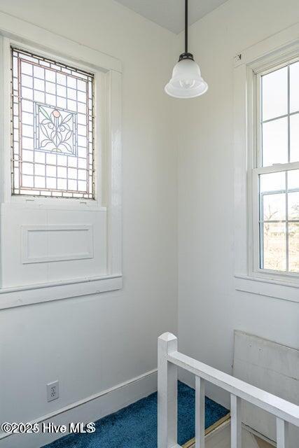 stairs featuring baseboards