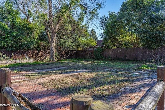 fenced backyard featuring a patio area