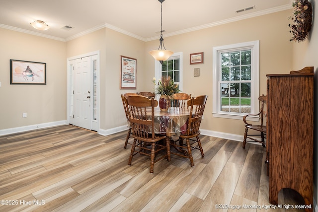 118 Hill Creek Rd, Blounts Creek, NC 27814 - dining area featuring wood finished floors, baseboards, and ornamental molding