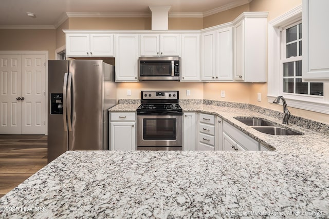 118 Hill Creek Rd, Blounts Creek, NC 27814 - kitchen featuring appliances with stainless steel finishes, a sink, white cabinets, light stone counters, and crown molding