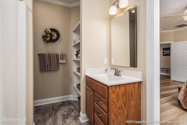 118 Hill Creek Rd, Blounts Creek, NC 27814 - bathroom featuring ornamental molding, a ceiling fan, vanity, and baseboards