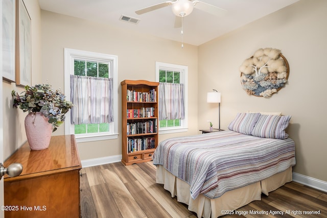 118 Hill Creek Rd, Blounts Creek, NC 27814 - bedroom with wood finished floors, multiple windows, and baseboards
