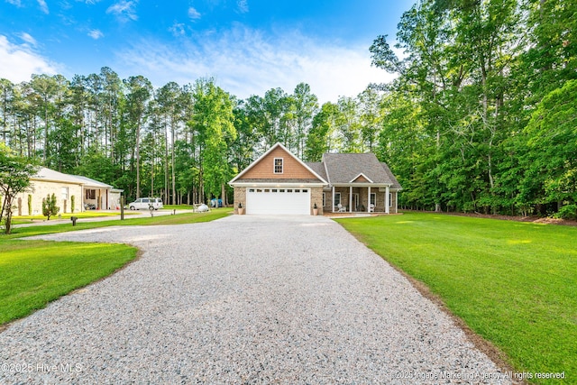 118 Hill Creek Rd, Blounts Creek, NC 27814 - craftsman-style home featuring a porch, driveway, an attached garage, and a front lawn
