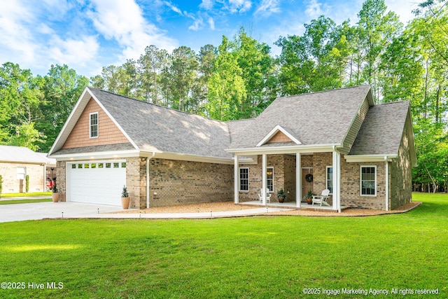 118 Hill Creek Rd, Blounts Creek, NC 27814 - view of front of property with a shingled roof, brick siding, covered porch, and a front lawn