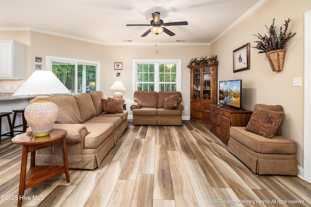 118 Hill Creek Rd, Blounts Creek, NC 27814 - living area featuring light wood-style floors, a ceiling fan, crown molding, and baseboards