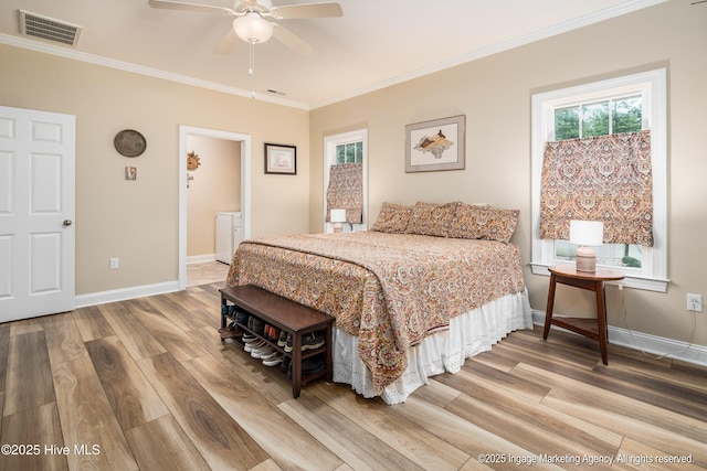 118 Hill Creek Rd, Blounts Creek, NC 27814 - bedroom with light wood-type flooring, ornamental molding, baseboards, and separate washer and dryer