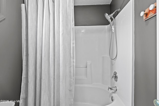 415 Point View Ct, Wilmington, NC 28411 - bathroom featuring shower / bathtub combination with curtain and a textured ceiling