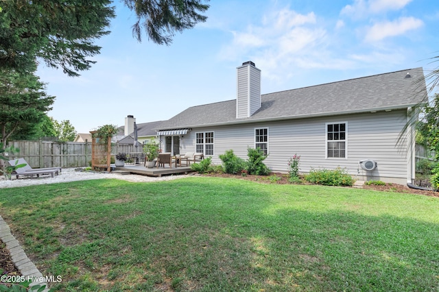 415 Point View Ct, Wilmington, NC 28411 - rear view of house with a wooden deck, a chimney, a shingled roof, and a cooling unit