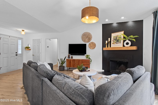 415 Point View Ct, Wilmington, NC 28411 - living room featuring light wood finished floors, a fireplace, recessed lighting, baseboards, and vaulted ceiling