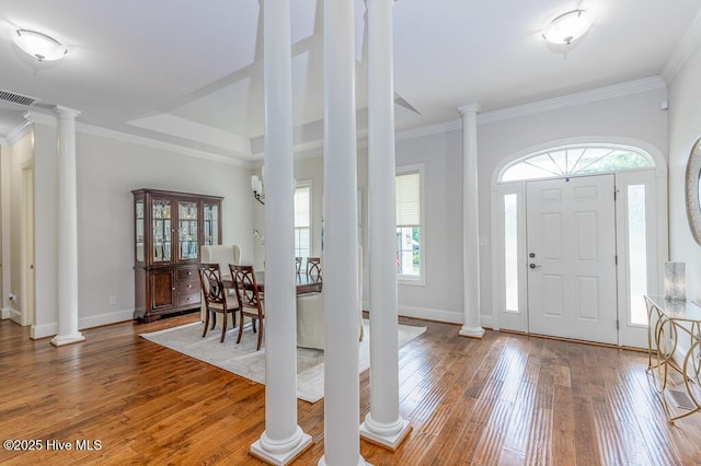4010 Sienna Trl, New Bern, NC 28562 - foyer featuring decorative columns, hardwood / wood-style flooring, crown molding, and baseboards