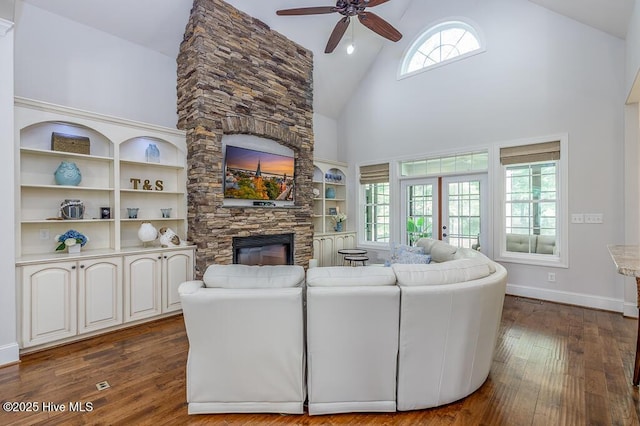 4010 Sienna Trl, New Bern, NC 28562 - living area with a fireplace, high vaulted ceiling, a ceiling fan, dark wood-type flooring, and baseboards