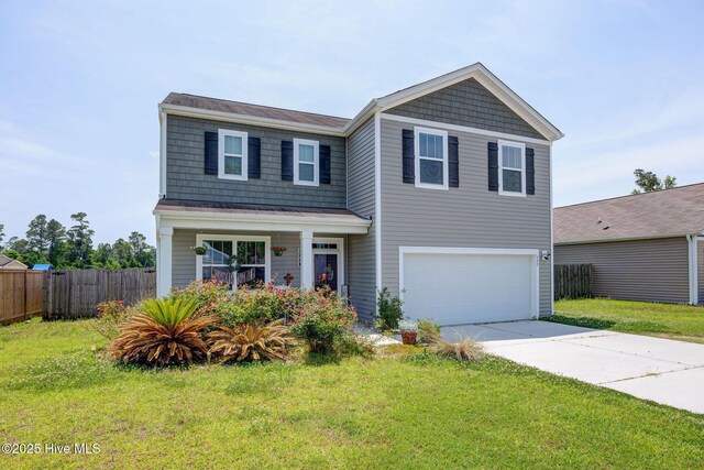 view of front of property featuring a garage, driveway, and covered porch
