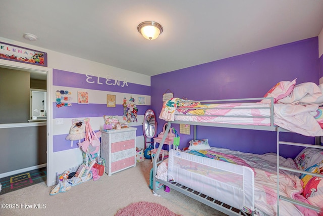 bedroom featuring carpet flooring and baseboards