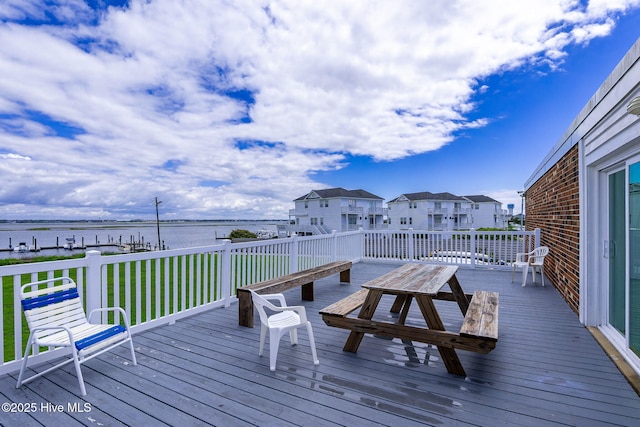 1918 W Fort Macon Rd Unit 205Bogue, Shores Condominium, Atlantic Beach, NC 28512 - wooden deck featuring a water view and a lawn