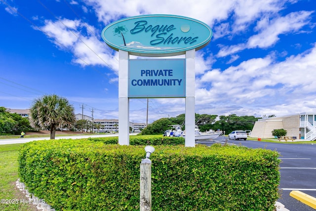 1918 W Fort Macon Rd Unit 205Bogue, Shores Condominium, Atlantic Beach, NC 28512 - community / neighborhood sign featuring uncovered parking
