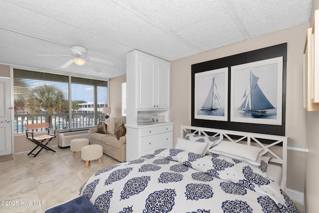 1918 W Fort Macon Rd Unit 205Bogue, Shores Condominium, Atlantic Beach, NC 28512 - bedroom with a textured ceiling and a ceiling fan