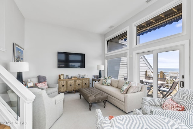 301 Salter Path Rd Unit 72Genesis, Pine Knoll Shores, NC 28512 - living room with carpet flooring and a towering ceiling