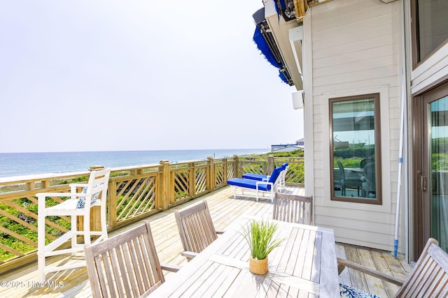 301 Salter Path Rd Unit 72Genesis, Pine Knoll Shores, NC 28512 - wooden deck with a water view and outdoor dining space