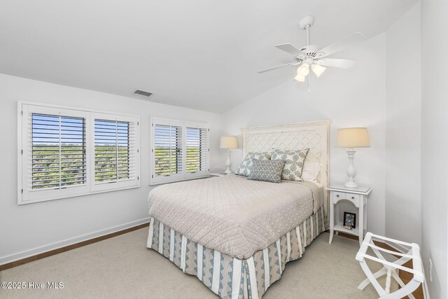 301 Salter Path Rd Unit 72Genesis, Pine Knoll Shores, NC 28512 - bedroom featuring baseboards, lofted ceiling, light carpet, and a ceiling fan