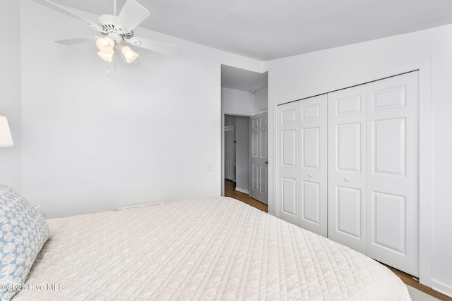 301 Salter Path Rd Unit 72Genesis, Pine Knoll Shores, NC 28512 - bedroom featuring a closet, wood finished floors, and a ceiling fan