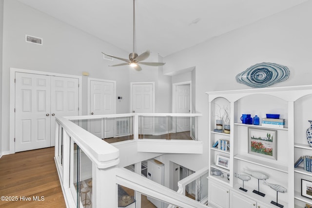 301 Salter Path Rd Unit 72Genesis, Pine Knoll Shores, NC 28512 - corridor featuring wood finished floors and high vaulted ceiling
