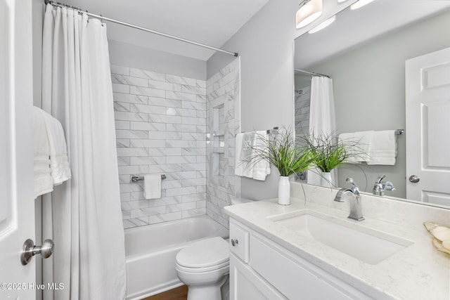 301 Salter Path Rd Unit 72Genesis, Pine Knoll Shores, NC 28512 - bathroom featuring vanity, shower / bath combo with shower curtain, and toilet