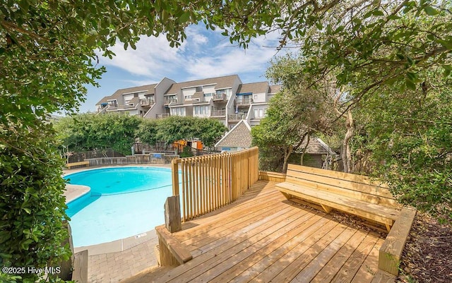 301 Salter Path Rd Unit 72Genesis, Pine Knoll Shores, NC 28512 - view of swimming pool with a deck and a residential view