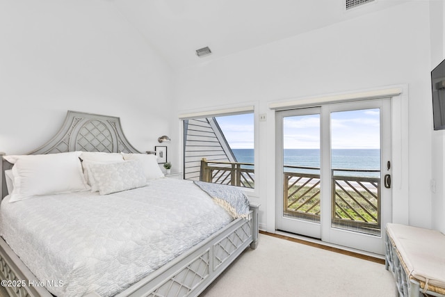 301 Salter Path Rd Unit 72Genesis, Pine Knoll Shores, NC 28512 - bedroom with access to outside, a water view, high vaulted ceiling, and light wood-style floors