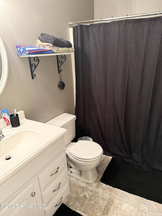 full bathroom with toilet, vanity, and a shower with curtain