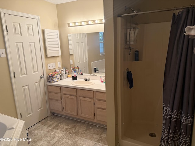 full bath with a shower stall and vanity