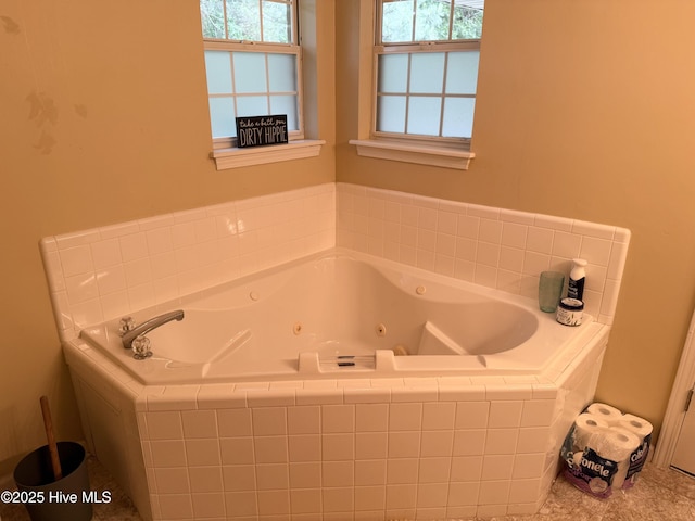 full bathroom with a whirlpool tub