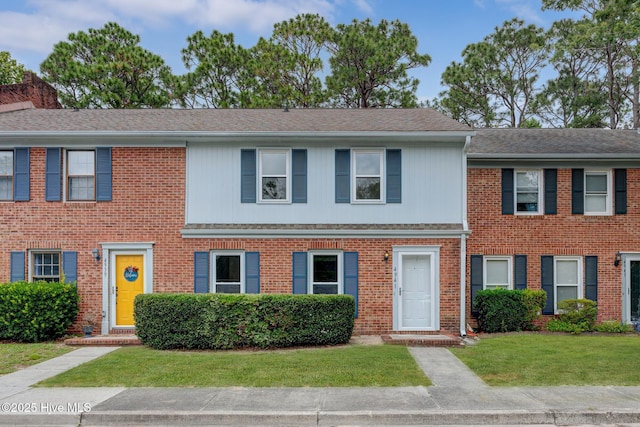 4941 Marlin Ct, Wilmington, NC 28403 - multi unit property featuring a front lawn, brick siding, and a shingled roof