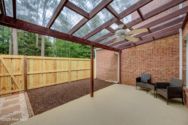 4941 Marlin Ct, Wilmington, NC 28403 - fenced backyard with a ceiling fan, a patio area, and a pergola