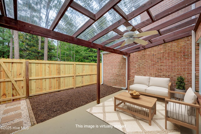 4941 Marlin Ct, Wilmington, NC 28403 - fenced backyard with a ceiling fan, a pergola, outdoor lounge area, and a patio area