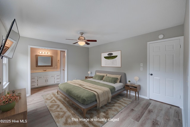 4941 Marlin Ct, Wilmington, NC 28403 - bedroom with wood finished floors, baseboards, ensuite bath, and a ceiling fan