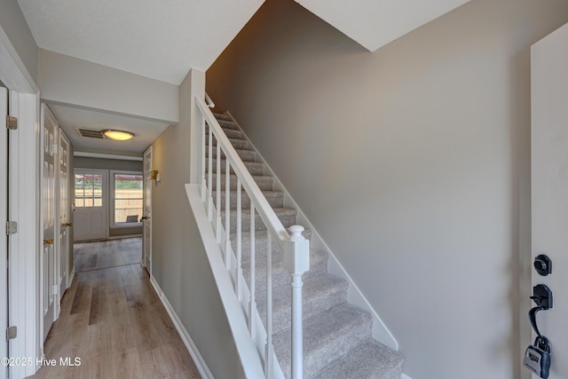 4941 Marlin Ct, Wilmington, NC 28403 - stairway featuring wood finished floors and baseboards