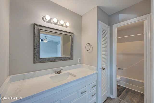 4941 Marlin Ct, Wilmington, NC 28403 - full bath featuring vanity, toilet, wood finished floors, a closet, and shower / bath combination