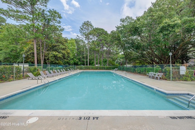 4941 Marlin Ct, Wilmington, NC 28403 - community pool featuring view of scattered trees and a patio