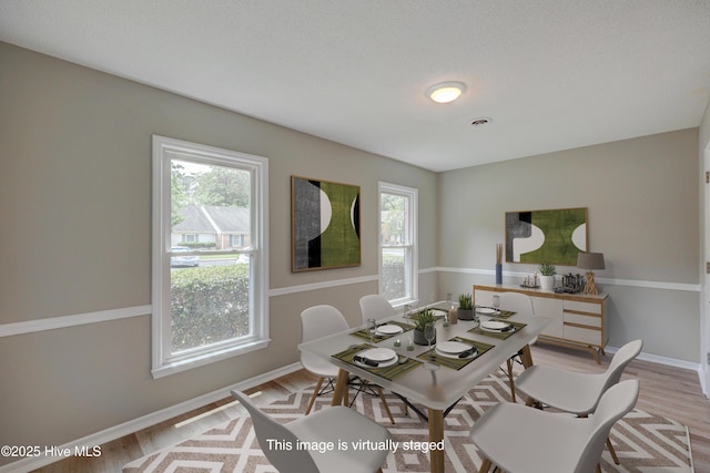 4941 Marlin Ct, Wilmington, NC 28403 - dining area featuring plenty of natural light, light wood-style floors, and baseboards
