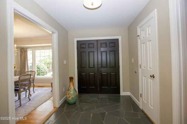 7 Saddle Pl, Pinehurst, NC 28374 - foyer with baseboards and stone finish floors