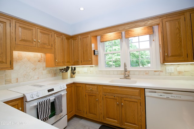 7 Saddle Pl, Pinehurst, NC 28374 - kitchen with white appliances and brown cabinetry