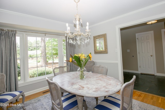 7 Saddle Pl, Pinehurst, NC 28374 - dining area with a chandelier, healthy amount of natural light, wood finished floors, and crown molding