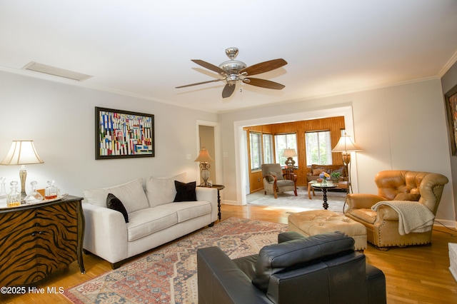 7 Saddle Pl, Pinehurst, NC 28374 - living area with ornamental molding, ceiling fan, and light wood-style flooring