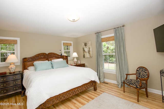7 Saddle Pl, Pinehurst, NC 28374 - bedroom with wood finished floors and multiple windows