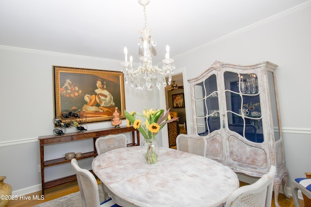 7 Saddle Pl, Pinehurst, NC 28374 - dining room featuring a chandelier, ornamental molding, and wood finished floors