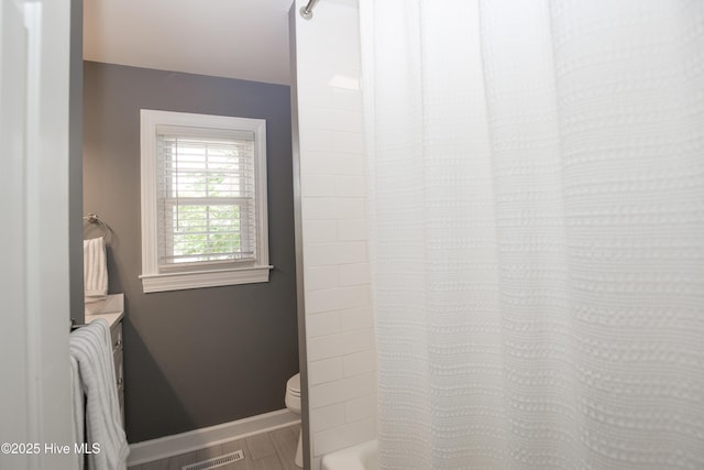 7 Saddle Pl, Pinehurst, NC 28374 - bathroom featuring vanity, wood finished floors, and shower / tub combo with curtain